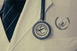 a doctor's coat with a stethoscope attached to it